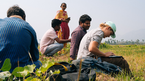 people sitting in a field