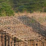 People living near the Eastern Arc Mountains use poles collected from the forests to build their homes. [Credit: Marije Schaafsma]